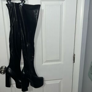 Black leather platform thigh high boots